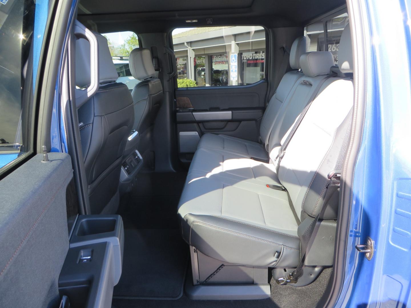 2022 BLUE /BLACK Ford F-150 Lariat Crew Cab 4WD (1FT6W1EV6NW) , located at 2630 Grass Valley Highway, Auburn, CA, 95603, (530) 508-5100, 38.937893, -121.095482 - Tired of gas prices and still want to look cool? Check out this Ford Lightning featuring a RC level kit, Nitto Ridge Grappler tires, Fuel Rebel wheels, Sinister front and rear bumpers, Baja Designs leds, Rigid Industries Leds, Bakflip F1, and window tint. - Photo#57